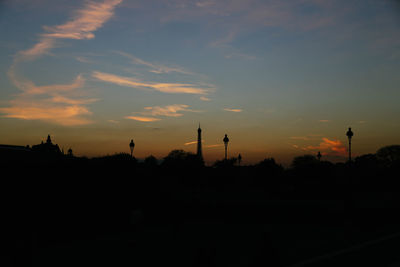 Silhouette trees against sky during sunset