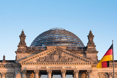 Low angle view of historical building against clear blue sky