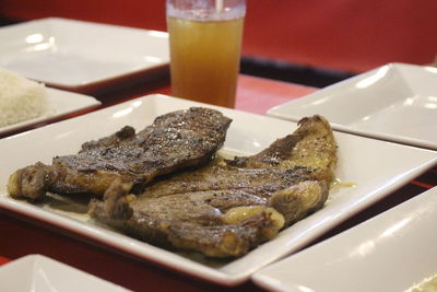 Close-up of meat in plate on table