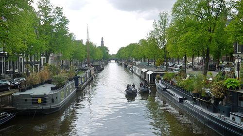 Panoramic view of river in city against sky
