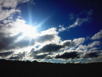 Sun shining over landscape