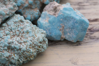 Close-up of precious stones on wooden table