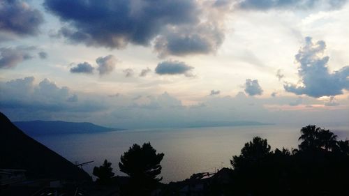 Scenic view of silhouette mountains against sky