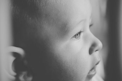 Close-up of baby boy looking away