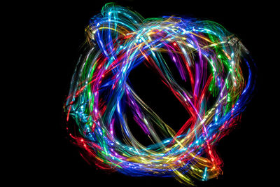 Illuminated light painting against black background