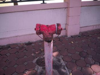 Red fire hydrant on footpath