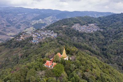 High angle view of townscape and mountains against sky