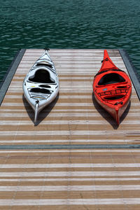 High angle view of kayaks on pier over lake