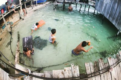 High angle view of people swimming in pool