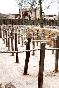 Wooden posts in front of built structure