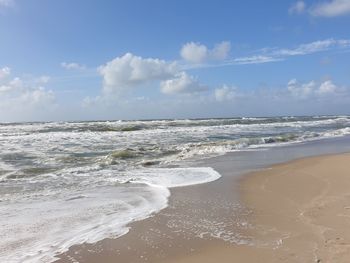 Scenic view of beach against sky