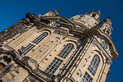 Low angle view of building against blue sky