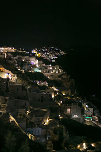 High angle view of illuminated houses at night