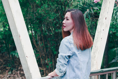 Portrait of young woman looking away