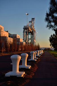 View of factory against clear blue sky