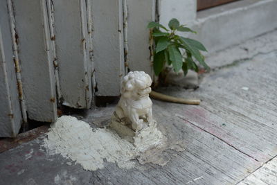 Close-up of statue against wooden table