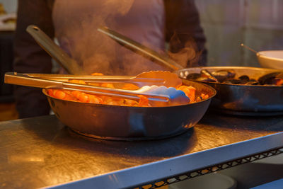 Cropped image of person preparing food