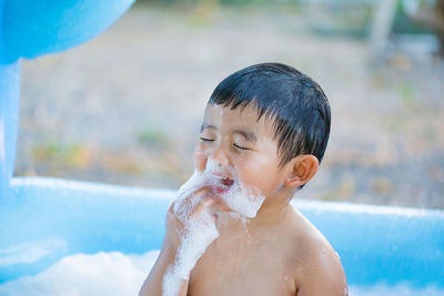 High angle view of boy in bathtub