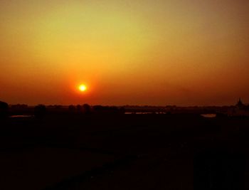 Scenic view of landscape against sky during sunset