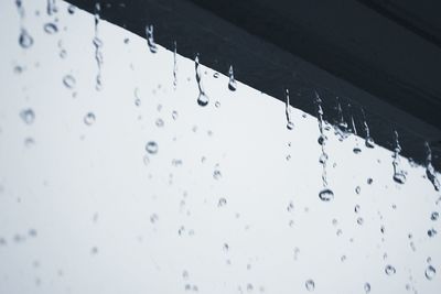 Rain drops on water