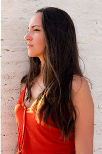 Portrait of beautiful woman standing at beach