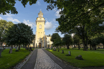 A panoramic view of the st. mary magdalene church from the cemetery park