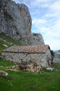 Old ruins on mountain against sky