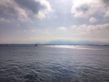 Scenic view of sea against cloudy sky