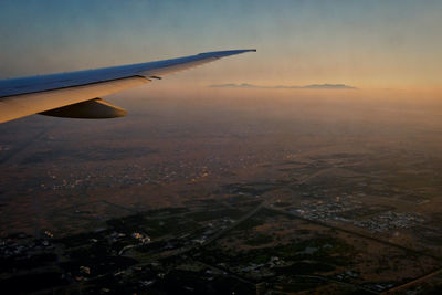 Aerial view of city at sunset