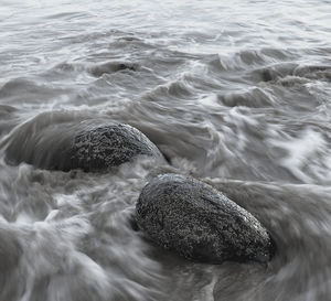 High angle view of water flowing in sea