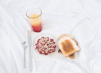 High angle view of breakfast on tablecloth