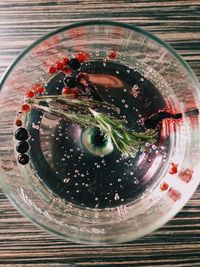 High angle view of glass of drink on table