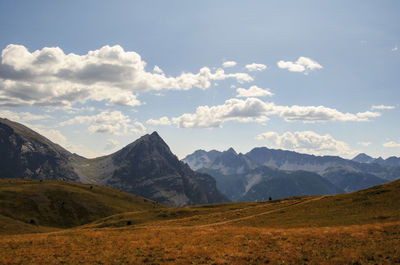 Scenic view of landscape and mountains against sky