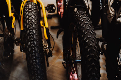 Low section of person with bicycle on road