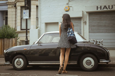 Rear view of woman with umbrella