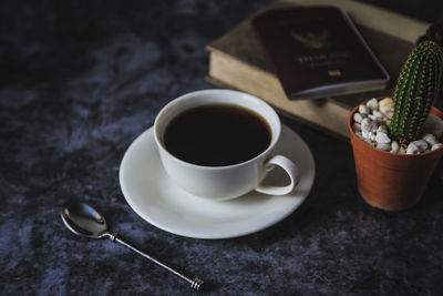 Tea cup and coffee on table