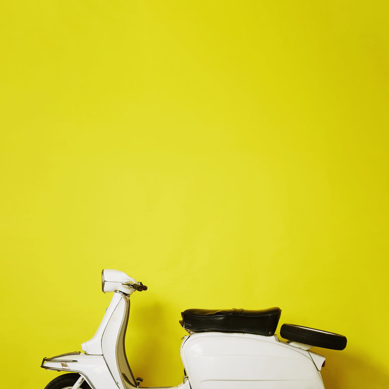 CLOSE-UP OF TOY CAR AGAINST YELLOW BACKGROUND