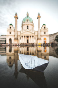 View of mosque in city at waterfront