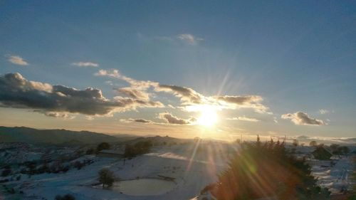 Scenic view of landscape against sky during sunset