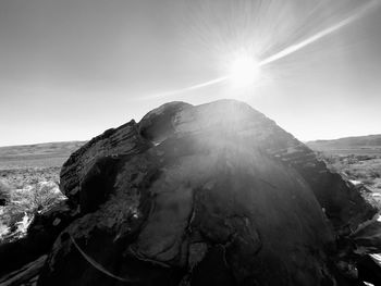 Scenic view of mountains against sky on sunny day