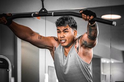 Portrait of man exercising in gym