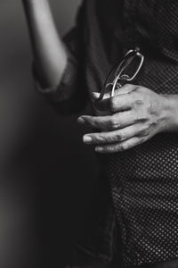 Close-up of man holding hands