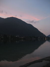 Scenic view of mountains against sky at sunset