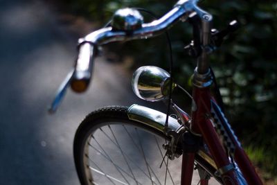 Close-up of bicycle on road at night