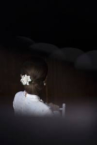 High angle view of woman standing in darkroom