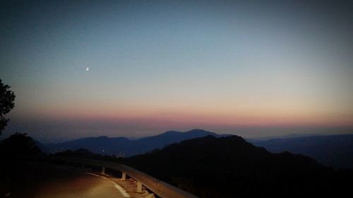 Scenic view of mountains at sunset