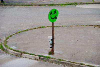 High angle view of road sign on street