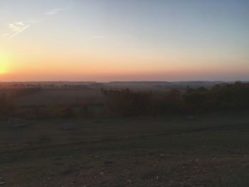 Scenic view of landscape against sky during sunset