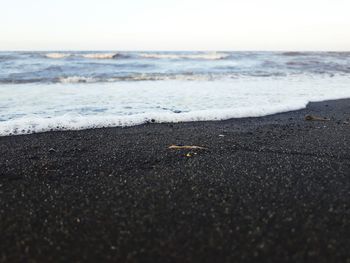 Surface level of beach against sky