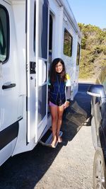 Portrait of girl on holidays next to motorhome